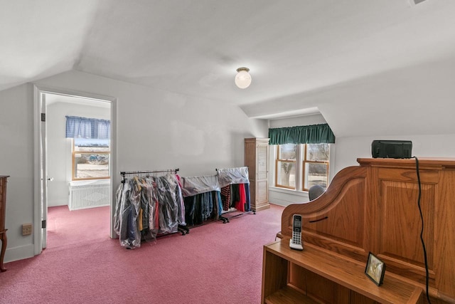 miscellaneous room featuring carpet, vaulted ceiling, and baseboards