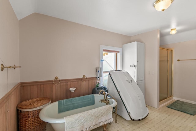 interior space with vaulted ceiling and wainscoting