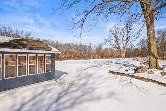 view of yard covered in snow