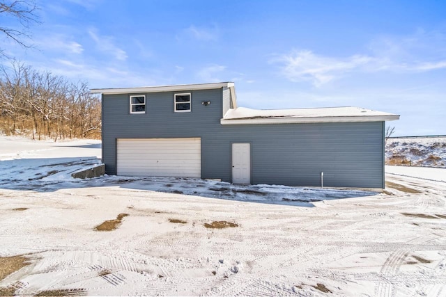 view of snow covered garage