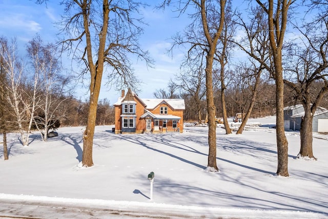 view of yard layered in snow