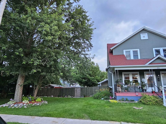 exterior space with fence and a porch