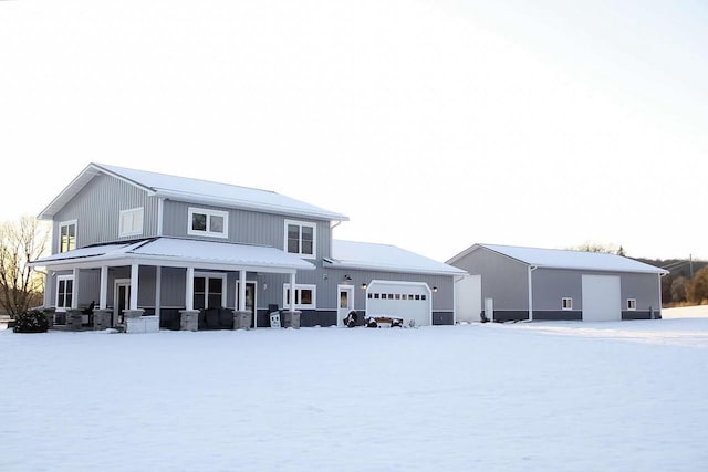 view of front of home with metal roof and an attached garage