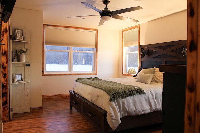 bedroom with dark wood-style floors and ceiling fan