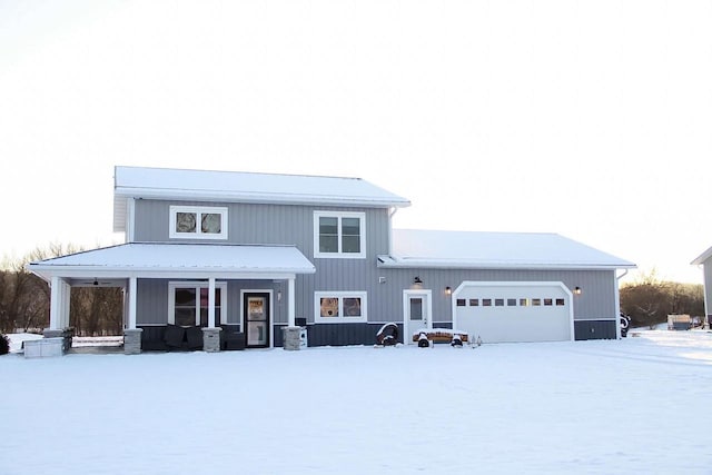 view of front of house with a garage and a porch