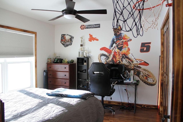 bedroom featuring a ceiling fan and wood finished floors