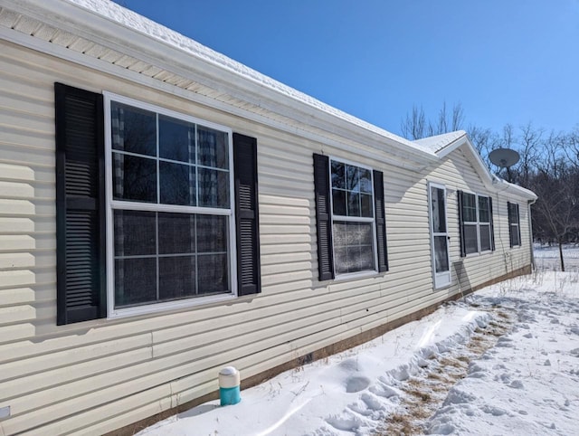 view of snow covered property