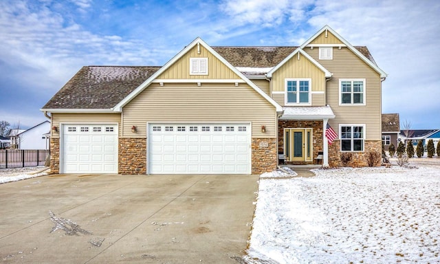 view of front of property featuring a garage, a shingled roof, fence, driveway, and board and batten siding