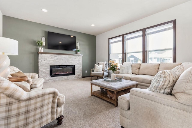 living room featuring a fireplace, carpet flooring, and recessed lighting