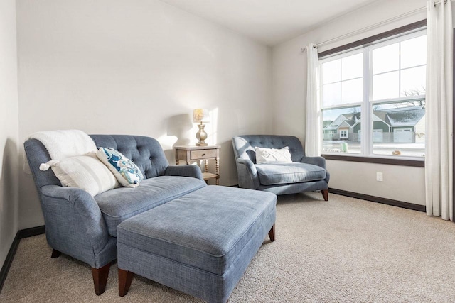 sitting room with carpet and baseboards