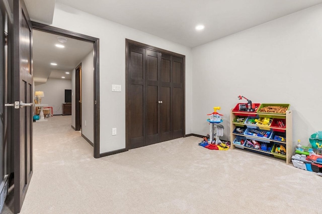 playroom with recessed lighting, light colored carpet, and baseboards