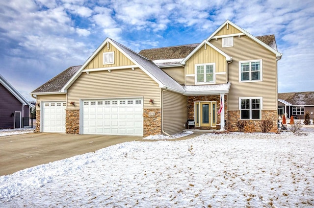 craftsman-style house featuring board and batten siding, concrete driveway, stone siding, and a garage