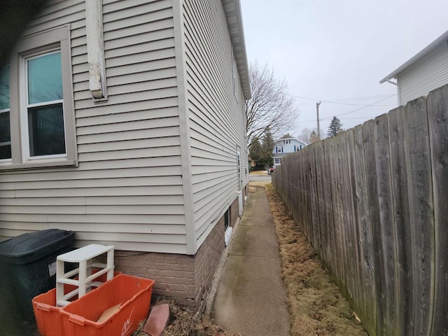 view of home's exterior featuring fence