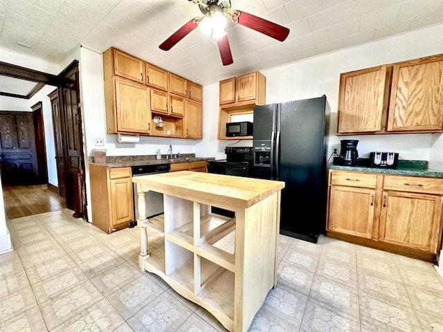 kitchen with light floors, open shelves, wood counters, a ceiling fan, and black appliances