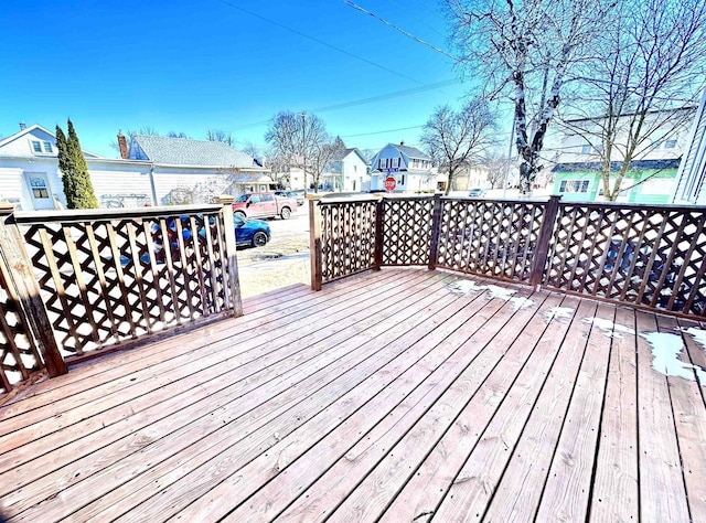 wooden terrace with a residential view