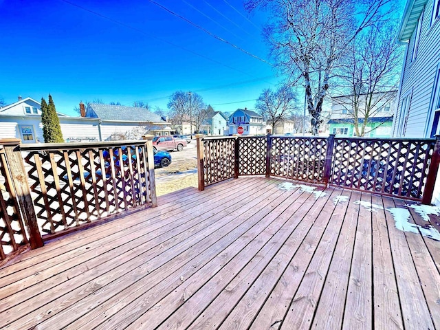 wooden deck featuring a residential view