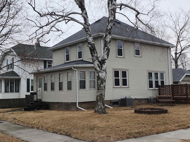 view of home's exterior featuring central AC and a deck