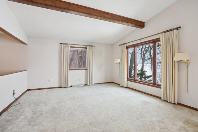 empty room with carpet floors, vaulted ceiling with beams, and baseboards