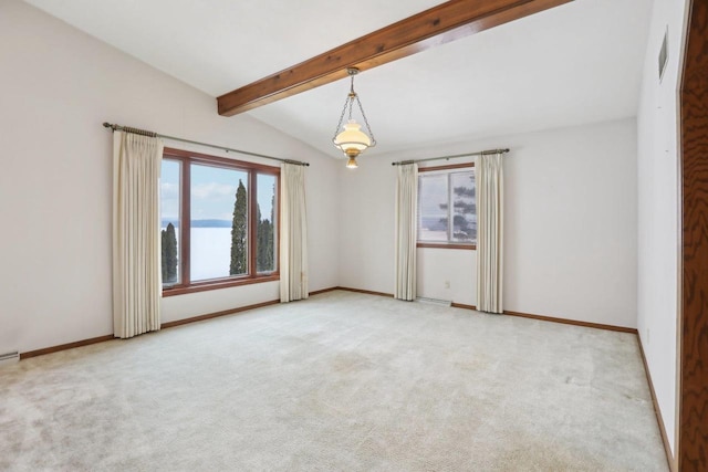 unfurnished room featuring lofted ceiling with beams, light carpet, and baseboards