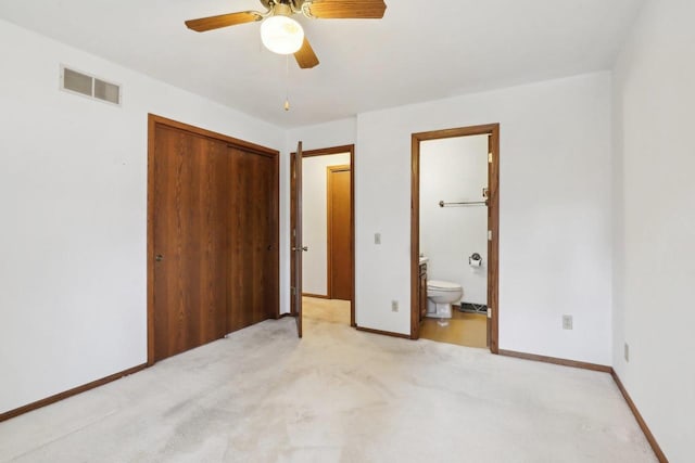 unfurnished bedroom with light carpet, baseboards, visible vents, connected bathroom, and a closet