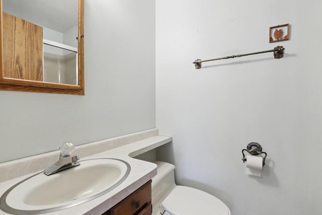 bathroom featuring vanity and toilet