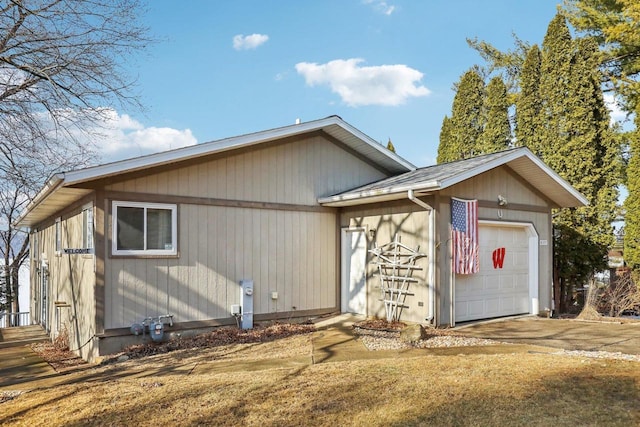 view of front of property with an attached garage and concrete driveway