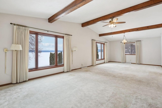 unfurnished room with carpet, ceiling fan, lofted ceiling with beams, and baseboards