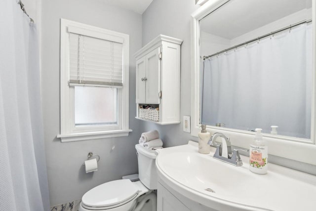 full bath featuring toilet and vanity