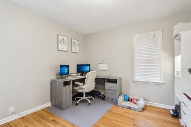 office with wood finished floors and baseboards