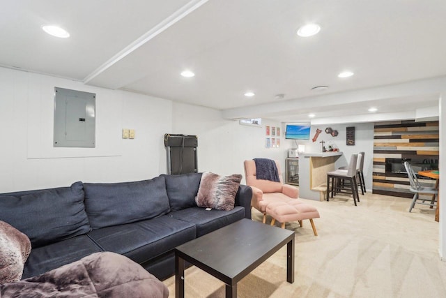 living area featuring light carpet, wood walls, electric panel, and recessed lighting