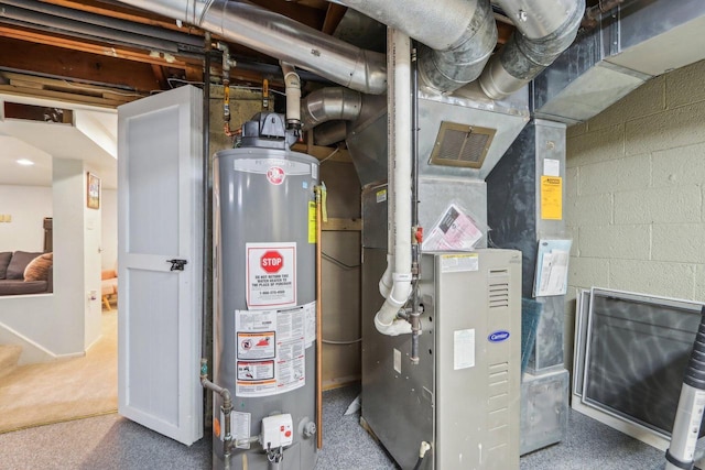 utility room with heating unit and gas water heater