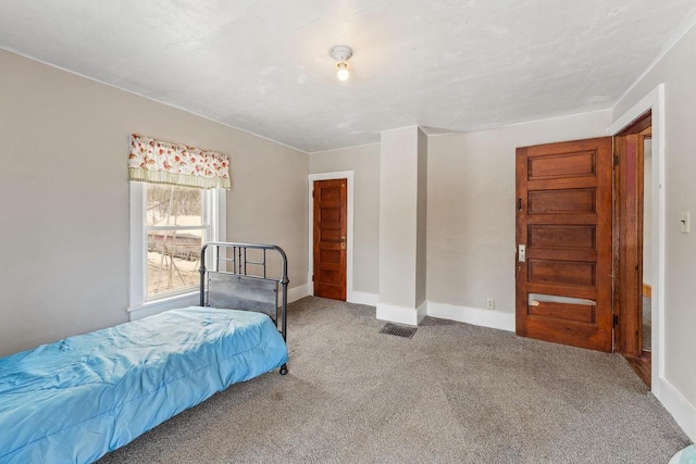 carpeted bedroom with baseboards