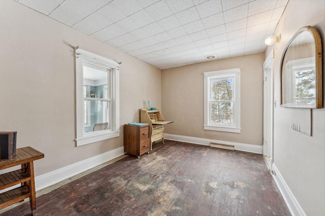 unfurnished room featuring visible vents and baseboards