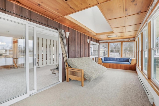 unfurnished sunroom featuring wood ceiling and a baseboard heating unit