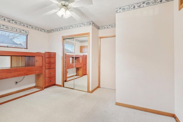 bedroom with a ceiling fan, a closet, baseboards, and carpet flooring