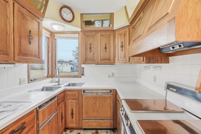 kitchen featuring electric stove, light countertops, custom range hood, a sink, and dishwasher