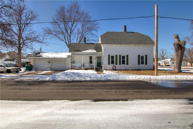 view of front of home with a garage and a porch