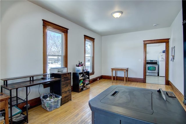 office space featuring light wood finished floors and baseboards