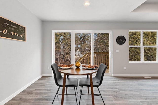 dining space featuring recessed lighting, visible vents, baseboards, and wood finished floors