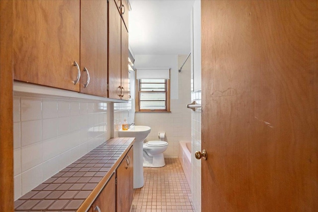 full bathroom featuring mail area, shower / tub combination, tile patterned flooring, tile walls, and toilet