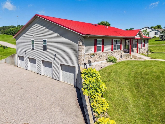 517 Darcy Dr, Hillsboro, WI 54634 - single story home with a front yard, metal roof, driveway, and an attached garage