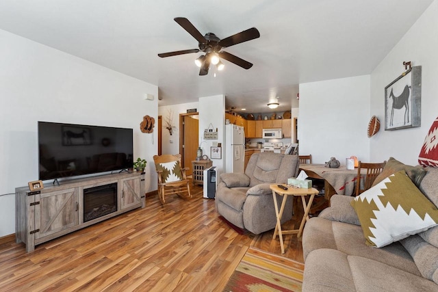 517 Darcy Dr, Hillsboro, WI 54634 - living area with ceiling fan and light wood-style flooring