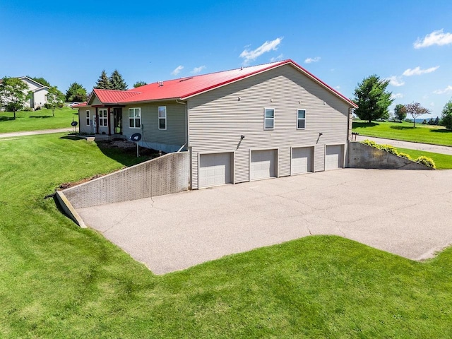517 Darcy Dr, Hillsboro, WI 54634 - exterior space with metal roof, a yard, driveway, and an attached garage