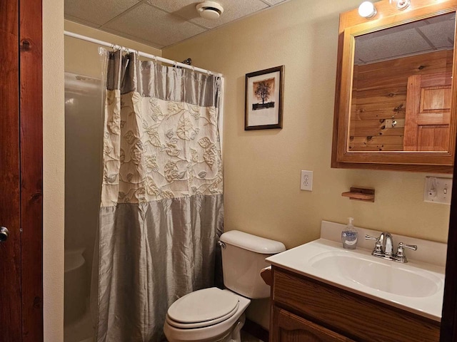 full bathroom featuring toilet, vanity, and a shower with curtain