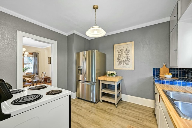 kitchen with wood counters, light wood-style flooring, stainless steel fridge with ice dispenser, and white range with electric cooktop