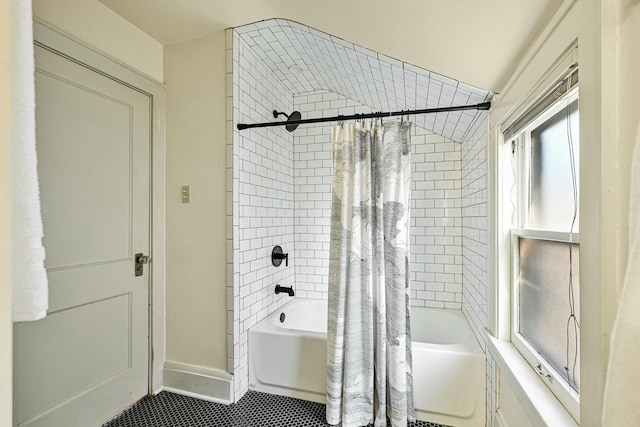 full bath featuring shower / bathtub combination with curtain and baseboards