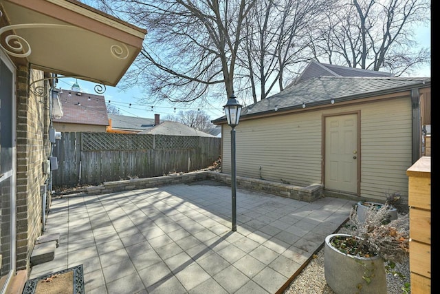 view of patio / terrace featuring fence