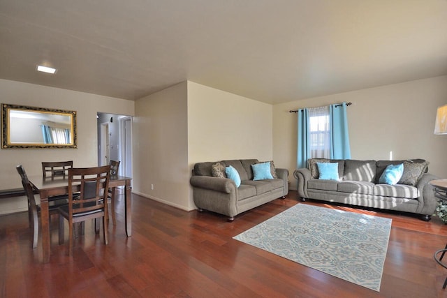 living area featuring wood finished floors and baseboards