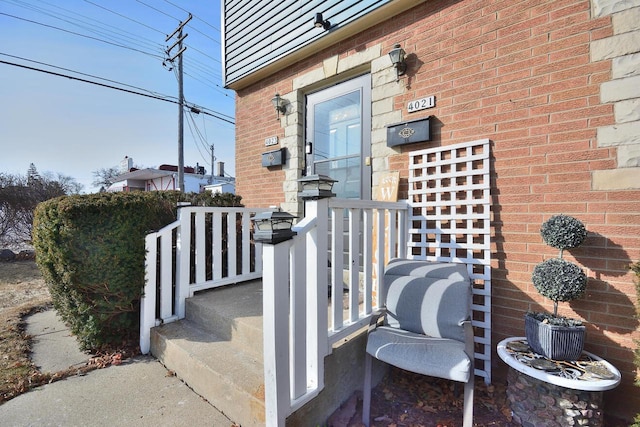 property entrance with brick siding