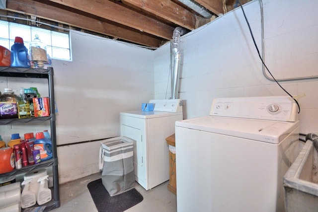 clothes washing area with laundry area and washer and clothes dryer